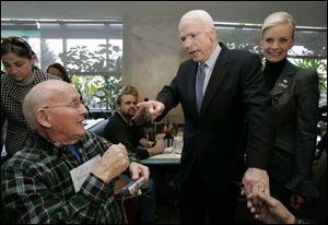 Joe Stockner, 74, of Perrysburg greets Sen. John McCain and his wife, Cindy, during a campaign stop at Charlie's Restaurant in Perrysburg. Yesterday's Perrysburg visit was Mr. McCain's first to the Toledo area during his bid for the GOP nomination. (THE BLADE/DAVE ZAPOTOSKY)
<br>
<img src=http://www.toledoblade.com/graphics/icons/photo.gif> <b><font color=red>VIEW</b></font color=red>: <a href=