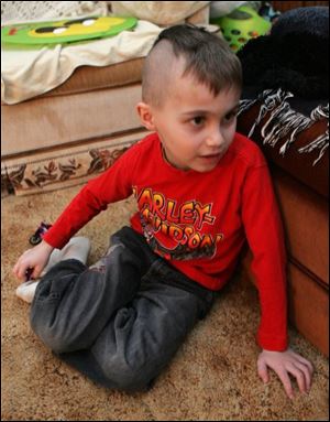 Bryan Ruda, 6, plays at home in Parma, Ohio on Tuesday. Bryan's Mohawk haircut has gotten him suspended from kindergarten at the Parma Community School.