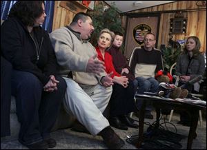 During a campaign stop by Sen. Hillary Clinton in Pomeroy, Ohio, Laura Nash, Bryan Holman, Mrs. Clinton, Jordan Holman, 12, Trent Nash, and Chelsea Clinton share concerns. The former fi rst lady vowed to help people struggling to make ends meet.
