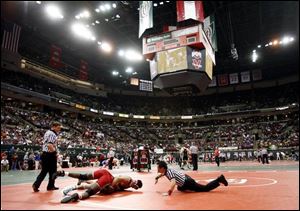 Oak Harbor's Cody Magrum records a pin of Demond Sanford of Finneytown in their 189-pound match in the Division II state wrestling tournament that began yesterday at the Schottenstein Center on the campus of Ohio State. (THE BLADE/ANDY MORRISON)
<br>
<img src=http://www.toledoblade.com/graphics/icons/photo.gif> <b><font color=red>VIEW</b></font color=red>: <a href=