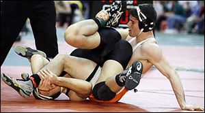 Liberty Center wrestler Chad McClory, right, and Nathan Jones of Troy Christian battle for a takedown during their Division III 189 pound championship semifinal.