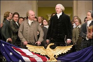 Paul Giamatti, center left, and David Morse in the new HBO series <i>John Adams</i>, debuting Sunday night.