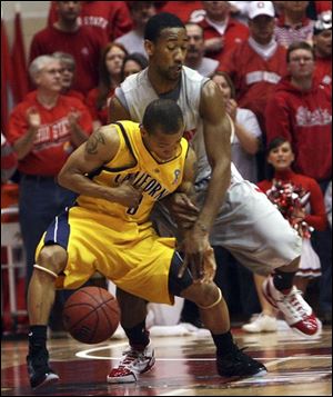 California's Jerome Randle, left, is fouled by Ohio State's David Lighty in a second-round NIT game at St. John Arena.