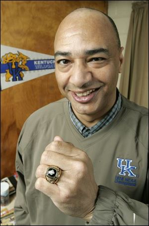 Toledoan Truman Claytor, who started at guard for Kentucky, shows off his NCAA championship ring from 1978.