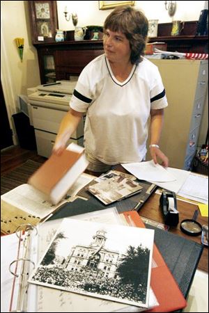 Tonia Hoffert, director of the Seneca County Museum, is documenting items for salvage from the courthouse.
