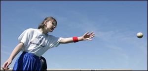 Elizabeth Case, 15, of Toledo tosses her way to first place in the Special Olympics softball throw during the Jennifer Adams Spring Games at the University of Toledo.