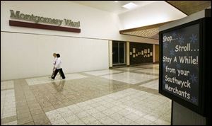 Walkers sometimes outnumber shoppers in the mostly vacant Southwyck Shopping Center.