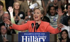 Democratic presidential hopeful Sen. Hillary Rodham Clinton, D-N.Y., acknowledges supporters during her West Virginia Primary night rally on Tuesday at the Charleston Civic Center in Charleston, W.Va. Clinton won the primary and says she's more determined than ever to press ahead with her campaign.