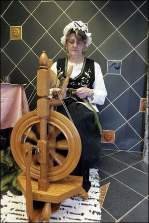 NBRN lost15p  Linda Kruzynski, of Temperance, spins wool into material for a scarf. The Monroe County Library System presents Lost Arts IV, with demonstrations of arts from the past, at the Bedford branch of the  library in Bedford, Michigan on May 10, 2008. Exhibits include woodcarving, weaving, quilting, spinning, etc.  The Blade/Jetta Fraser