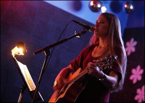 Guitarist, singer, and songwriter Kyle White performs at Mulvaney s Bunker on Dorr Street in West Toledo, one of the many places to see a vast range of live music in the area.
