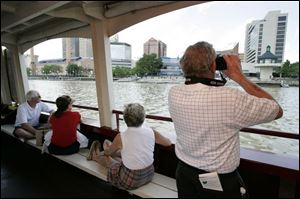 Taking in the sights during a two-hour tour of Toledo from a
different vantage point   the Maumee River   are, from left,
Lee and Betty Kreuz of Swanton, Brenda Haag of Toledo, and
Don Hutzel of Tiffi n.
