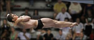 David Colturi of Sylvania, an All-American at Purdue University, spins through a dive off the 10-meter platform competing in the U.S. Olympic Trials.