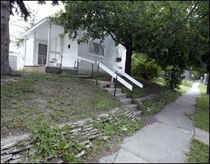 Tom s house, owned by a landlord who has declared bankruptcy.
