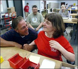 Bill Clifford, superintendent of Wood County Board of Mental Retardation and Developmental Disabilities, greets Janice Richendollar at the Wood County workshop where he was making a farewell round.