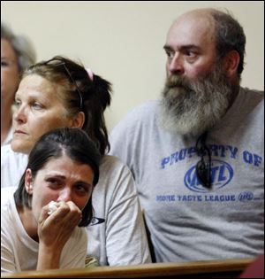 Family and friends of Corey S. Flugga watch in Findlay Municipal Court. 