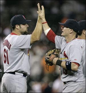 Nick Stavinoha, left, and Brendan Ryan celebrate the win.
