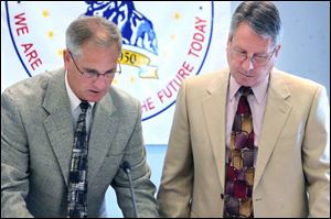 Anthony Wayne Local School District Superintendent John Granger, left, and board President Don Atkinson confer at the district administration building in Whitehouse. The district is asking voters to approve two levy requests on the ballot. If passed, the measures would increase annual revenue by $6 million.