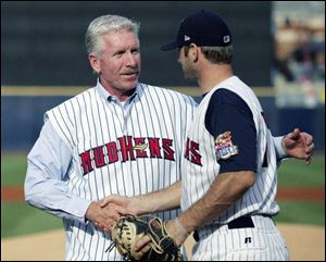 Hens catcher Max St-Pierre shakes hands with Mike Schmidt
after the Hall of Fame third baseman threw out the first pitch.
