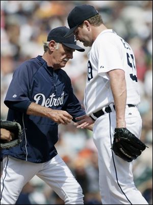 Tigers manager Jim Leyland takes ball from an apparently 
disgusted Todd Jones after he lost 6-4 lead in ninth inning.