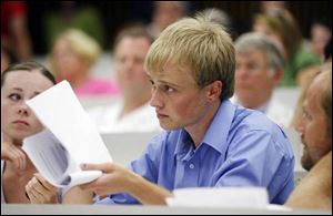 Evan Morrison reminds Dr. Jacobs that policy, not personality, is of greater concern to students, during yesterday s meeting.