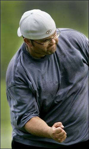 Clint  Schreiber gets pumped up after nailing a par putt on the 12th hole of the Jermain Memorial Match-Play Championship at Ottawa Park golf course yesterday.