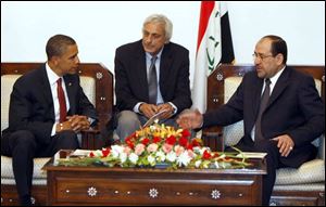 Sen. Barack Obama (D., Ill.) talks with Iraqi Prime Minister Nouri al-Maliki in Baghdad with an
unidentifi ed man at center. Iraqi offi cials backed withdrawal of all U.S. combat troops in 2010.
