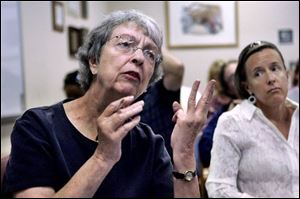 Mary Rose Donahue of Toledo says during a hearing at TARTA headquarters that proposed service cuts will force her to ride three TARTA buses to get her to where she needs to go. (THE BLADE/DAVE ZAPOTOSKY)
<br>
<img src=http://www.toledoblade.com/assets/gif/weblink_icon.gif> <font color=red> <b>READ</font color=red></b>: <a href=