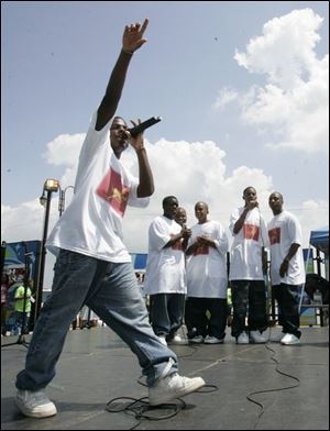 Singer Jalen Middlebrooks and his group, Solomon Temple, entertain during the third annual Hip Hop for Humanities festival in downtown Toledo's Promenade Park yesterday.