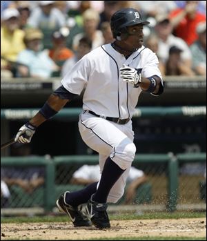 Detroit s Curtis Granderson hits a solo home run off Chicago sJavier Vazquez in the third inning yesterday. Granderson has eight doubles, four triples and three home runs in his last 32 games and batted in 11 runs. The Tigers now go on the road for 10 games.