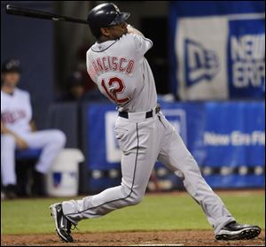 Indians outfielder Ben Francisco belts a solo home run against Twins pitcher Matt Guerrier in the eighth inning yesterday.