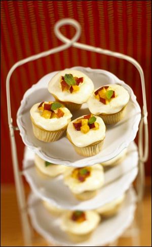 Mini Vanilla-Almond Peach Cupcakes with Fresh Peach Frosting.