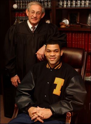 Judge Richard Warren, former guardian for University of Toledo
ex-basketball player Sammy Villegas, said he urged Mr.
Villegas to  tell the truth and cooperate. 
