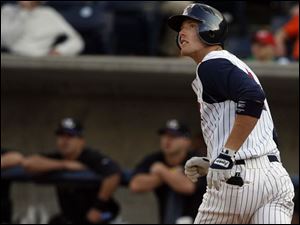 Mud Hens third baseman Kody Kirkland watches the flight of his home run during the second inning last night at Fifth Third Field. It was Kirkland s third home run with the Mud Hens.
