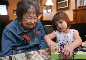 Lillian Fowler and great-great niece Eleanor Kelso celebrate Mrs. Fowler's 108th birthday yesterday at Fairways Restaurant in Sylvania Township. Mrs. Fowler still enjoys a martini - she had one at lunch.