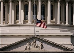 The flag flies at half-staff at the U.S. Capitol in honor of Rep. Stephanie Tubbs Jones, a Democrat who represented the Cleveland area. She died Wednesday from a brain hemorrhage.