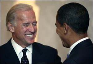 Presidential hopeful, Sen. Joseph Biden, D-Del., speaks with Sen. Barack Obama, D-Ill., at the Sisters on Target banquet in Des Moines, Iowa, in this Saturday, Oct. 13, 2007 file photo. Barack Obama selected Sen. Joe Biden of Delaware late Friday night aUG. 22, 2008 to be his vice presidential running mate, according to a Democratic official, balancing his ticket with an older congressional veteran well-versed in foreign and defense issues.