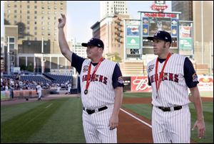 Mud Hens pitcher Blaine Neal, left, and third baseman Mike Hessman wear the bronze medals they picked up in Beijing as members of the U.S. Olympic baseball team.