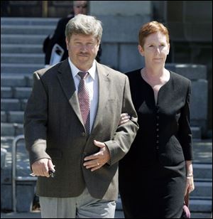 Andrew Siemaszko and his wife, Sandra, leave federal court after he was found guilty in federal court of three counts. He faces up to five years in prison and a $250,000 fine.