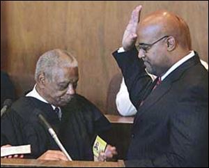 Detroit Mayor Ken Cockrel Jr., right, is sworn in by U.S. Appeals Court Judge Damon Keith on Friday.