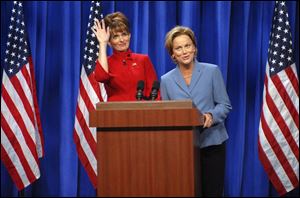 In this photo provided by NBC, actress Tina Fey, left, plays Governor Sarah Palin, and actress Amy Poehler plays Senator Hillary Clinton on <i>Saturday Night Live</i>  Sept. 13 in New York.