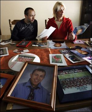 Jordan Laskey and his mother, Jodi, look over mementos.  To this day   I just think that this
wasn t intentional,  Ms. Laskey said. More than 4,200 young Americans commit suicide yearly