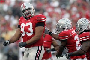 Ohio State defensive tackle Nader Abdallah, left, celebrates his sack of the Purdue quarterback in the fourth quarter.
<br>
<img src=http://www.toledoblade.com/graphics/icons/photo.gif> <font color=red><b>VIEW</font color=red></b>: <a href=