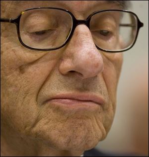 Former Federal Reserve Chairman Alan Greenspan pauses while testifying on Capitol Hill in Washington, Thursday.