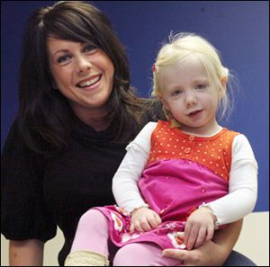 Courtney Taylor sits with her daughter, Addisyn, who was diagnosed with celiac disease, an intolerance to gluten, which is found in wheat and other grains. Since the diagnosis, Ms. Taylor has been eliminating gluten from her family's diet.