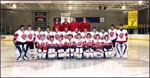 Members of the Monroe High School varsity hockey team are, from left, front row, Joshua Doll, Alexander Compean, Michael Durkin, Kyler Kleindeinst, John Mulligan, Matt Van Otten, Jordan Prewitt, Dillon Montalvo; middle row, Nick Roof, Cody Popovich, Brennan Gibbs, Dustin Pilgrim, Alec Swindeman, Stephan Mayes, Nick Diehl, Hank Meyerholtz, Zach Wilson, Joseph Smigielski, Gary Simmons, Cameron Barron, and back row, assistant coach Jason Clements, head coach Isaac Murphy, assistant coach Jeff Dare, assistant coach Mark Dare.