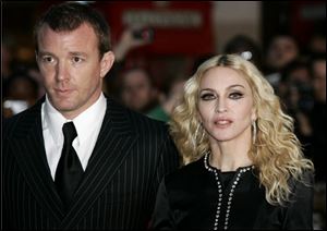 In this Sept. 1, 2008 file photo, British director Guy Ritchie, left, and Madonna arrive for the world premiere of his film 