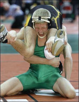 Delta s Jonny Tolson tries for a take down in the Division III state semifinal, where he lost to Galion Northmor s Tyler Heminger.