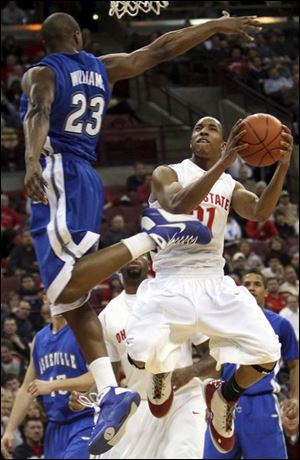 Ohio State's Evan Turner takes the ball to the basket against UNC-Asheville's John Williams last night in Columbus.