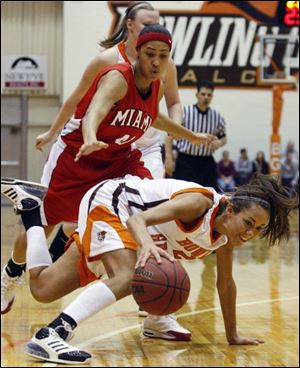 Bowling Green's Lauren Prochaska is tripped up on this play, but she hit 5 of 9 3-pointers and 13 of 14 free throws.