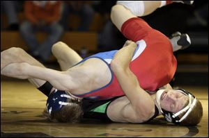 Delta's Jonny Tolson, right, won the 112-pound title with a takedown of Springfield's Garrett Manley in the final seconds. 